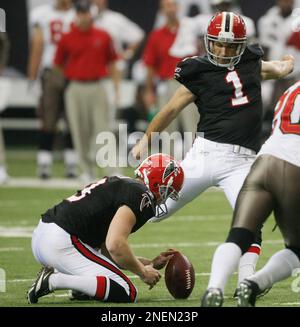 Atlanta Falcon place kicker Jason Elam, left, celebrates with holder  Michael Koenen after kicking a 48-yard field goal as time expired to give  the Falcons a 22-20 win over the Chicago Bears