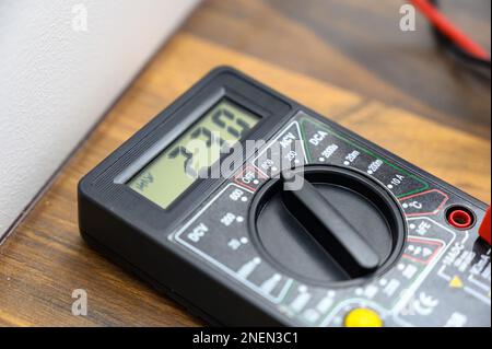 digital display of multimeter close-up. Tool for testing electrical equipment and electrical circuits. Stock Photo