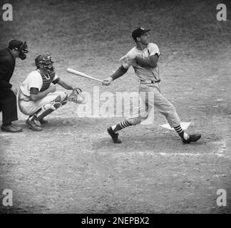 Stan Musial, old reliable for the St. Louis Cardinals, is a few feet short  at home plate and is tagged out by Cincinnati Reds catcher Johnny Edwards,  Sept. 11, 1962 in St.
