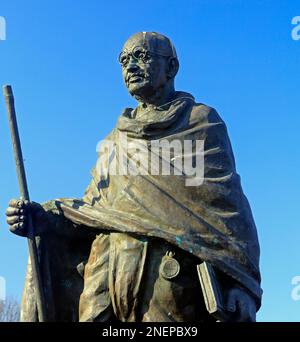 Mahatma Gandhi - Mohandas Karamchand Gandhi - full length statue. Cardiff Bay, South Wales. Sculptors Ram and Anil Sutar, Stock Photo