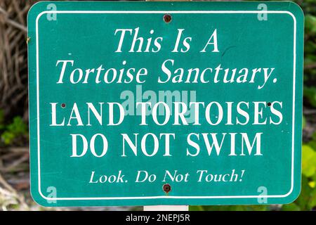 Barefoot Beach in Bonita Springs, Florida sign for gopher tortoise sanctuary in Gulf of Mexico closeup of text for animals do not swim and do not touc Stock Photo