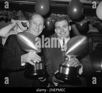 Y.A. Tittle, left, New York Giants back, poses with teammate Joe Walton in  dressing room at New York's Yankee Stadium following his team's 49-34  victory over Washington Redskins, Oct. 28, 1962. Title