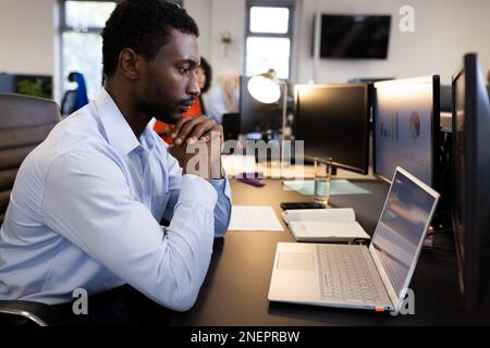 African american man working on laptop in office Stock Photo