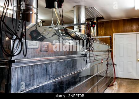 Maple syrup industrial machines that collect sap for production with stainless steel equipment and nobody in small factory business Stock Photo