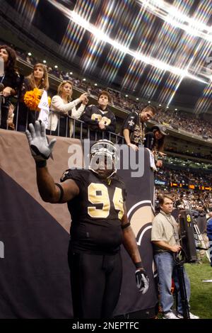 NFL player Charles Grant of the New Orleans Saints playing pool at