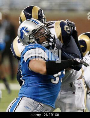 Detroit Lions' Dewayne White (99) goes up against Washington