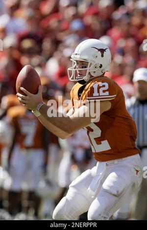 Texas quarterback Colt McCoy (12) rolls out during an NCAA college ...