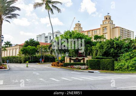 Naples, USA - December 28, 2021: Ritz-Carlton resorts spa hotel at Florida Southwest city Vanderbilt beach by palm trees entrance to building property Stock Photo