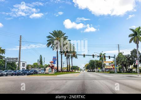 Hollywood, USA - February 12, 2022: Pembroke road in North Miami Broward county Florida state highway with many cars at traffic stoplight intersection Stock Photo