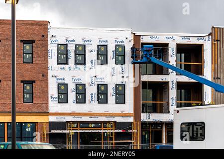 Carbondale, USA - September 29, 2022: New home construction site in Colorado with sign on scaffolding for Tyvek homewrap for Market Place Lofts Apartm Stock Photo