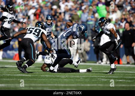 Jacksonville Jaguars' Brian Iwuh (59) and Jorge Cordova (58) pummel  Philadelphia Eagles punter Dirk Johnson after he punted the ball at Lincoln  Financial Field in Philadelphia, Pennsylvania, Sunday, October 29, 2006. The