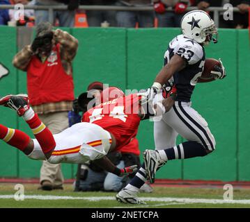 Oakland Raiders running back Darren McFadden (20) pushes off of Kansas City  Chiefs safety Jarrad Page (44) during the first half of an NFL football  game Sunday, Sept. 20, 2009, in Kansas