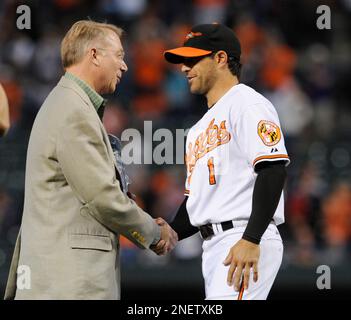 Baltimore Orioles' Brian Roberts congratulates Melvin Mora after Mora hit a  two-run homer, scoring Roberts, off Houston Astros pitcher Wandy Rodriguez  in the first inning Wednesday, June 15, 2005, in Baltimore.(AP Photo/Gail