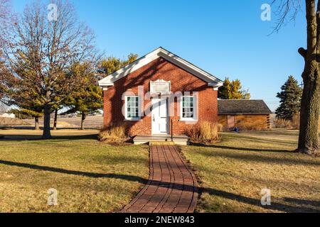 Old anandoned red brick one room schoolhouse in Bureau county, Illinois. Stock Photo