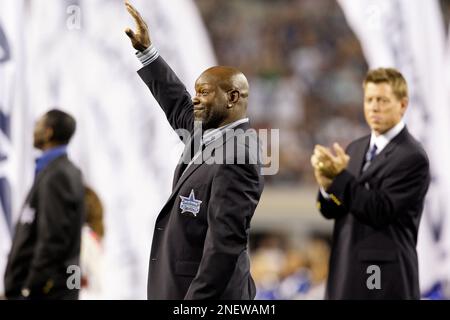 Former Dallas Cowboys players Michael Irvin, left, and Troy Aikman, right,  during a halftime ceremony in an NFL football game against the New York  Giants, Sunday, Sept. 20, 2009, in Arlington, Texas. (