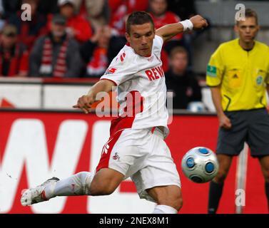 Cologne's Lukas Podolski's shoes with the name of his son Louis are seen  during the German first division Bundesliga soccer match between FC Cologne  and Eintracht Frankfurt in Cologne, Germany, Saturday, Aug.