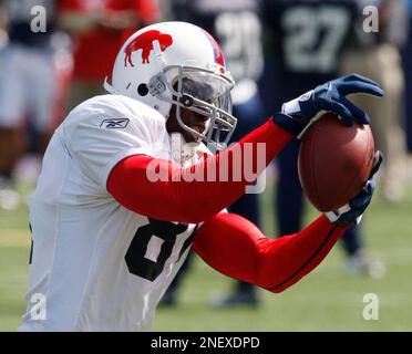 30 July 2009: Wide Reciever Terrell Owens of the Buffalo Bills unveils the  new throwback uniforms after the Bills Thursday night practice at St. John  Fisher College in Pittsford, New York. (Icon