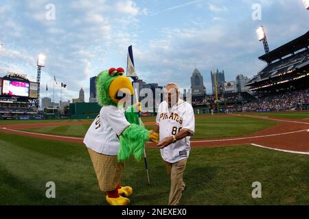 Golfing legend Arnold Palmer, right, hands a golf ball to Pittsburgh  Pirates owner Bob Nutting before a baseball game between the Pittsburgh  Pirates and Chicago Cubs in Pittsburgh Tuesday, Sept. 8, 2009.