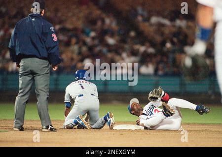 Los Angeles Dodgers Chad Fonville looks down as Houston Astros second  baseman Craig Biggio tags the base during the first inning of their game,  April 25, 1996 in Los Angeles. Fonville was