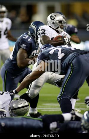 Oakland Raiders running back Michael Bush stretches during pre-game warm  ups at Invesco Field at Mile High on October 24, 2010 in Denver. UPI/Gary  C. Caskey Stock Photo - Alamy