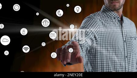 Composition of businessman touching screen with digital online icons. global technology, digital interface and communication concept digitally generat Stock Photo