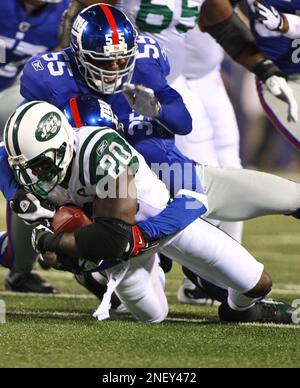 Washington Redskins' Santana Moss, left, makes a leaping catch in front of  New York Giants' Kevin Dockery in the second quarter, Sunday, December 16,  2007, at Giants Stadium in East Rutherford, New