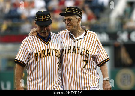Chuck Tanner, manager of the 1979 world champion Pittsburgh Pirates, draws  a laugh from players of that team, Dave Parker, right, Steve Nicosia,  center, and Omar Moreno, left, as he plays with