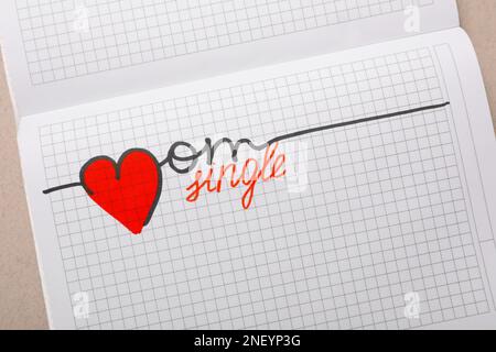 Notebook with words Single Mom on grey table, top view Stock Photo