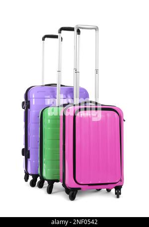 Stylish suitcases packed for travel on white background Stock Photo