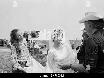 Federico Fellini the Italian film director, at right gives instructions to French actress Magali Noel (wearing wedding gown) on set of movie “Amarcord” near Bologna in 1973. The movie was awarded the Oscar prize as best film in foreign language April 9 in Santa Monica. Other’s unidentified. (AP Photo)