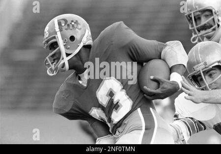 University of Pittsburgh tailback Tony Dorsett runs from Notre Dame  defensive end Ross Browner during the first quarter of their Saturday  afternoon game in Pittsburgh, Dorsett slashed the Irish defense for a