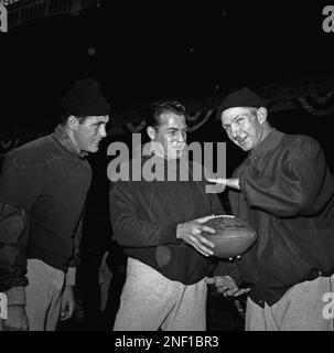 New York Giants' flanker back Frank Gifford (16) snares a pass