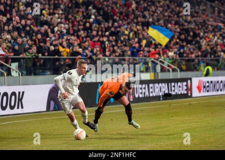 Warsaw, Poland. 16th Feb, 2023. Adrien Truffert (L) of Rennes in action during the UEFA Europa League 2022/23 1st leg play-off round football match between Shakhtar Donetsk and FC Stade Rennais at Marshal Jozef Pilsudski Municipal Stadium of Legia Warsaw. Final score: Shakhtar Donetsk 2:1 Rennes. Credit: SOPA Images Limited/Alamy Live News Stock Photo