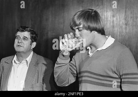 Stanford University quarterback John Elway, right, laughs with his