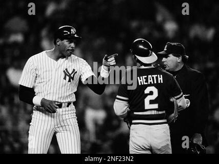 May 27, 1983 New York Yankee Dave Winfield grabs Oakland A's catcher Mike  Heath by the throat as they fought in front of the mound when Winfield  objected to a knock down pitch by Mike Norris in the 1st inning at Yankee  stadium. Heath prevented