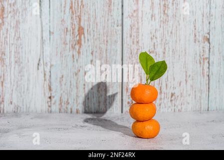 mini clementines on a wooden background from Thailand Stock Photo