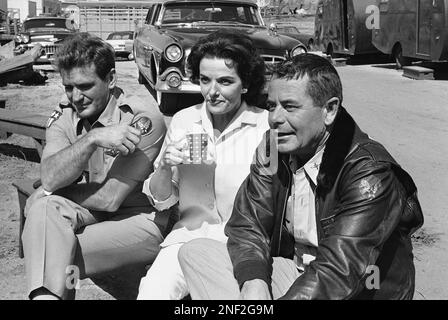 Relaxing between scenes actor Rod Taylor, left, actress Jane