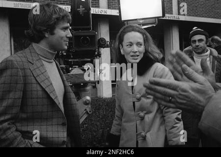 Charlotte Ford Niarchos, daughter of auto industrialist Henry Ford II, talks with Ryan O'Neal on movie location at Mt. Sinai Hospital in New York on Jan. 26, 1970. Mrs. Niarchos in making her screen debut in 'Love Story,' playing the part of a receptionist. O'Neal stars in the film. (AP Photo/Jack Harris)