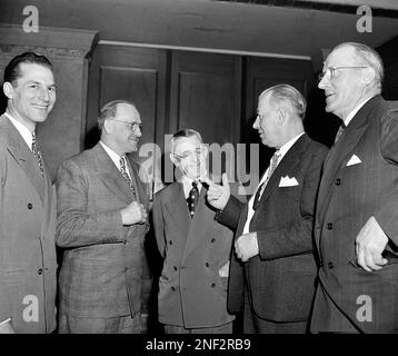 George Halas, owner-president of the Chicago Bears, seems to have some  interested listeners in Jack Jennings, center, of the Chicago Cardinals,  and Chuck Bednarik, right, of the Philadelphia Eagles, as they wait