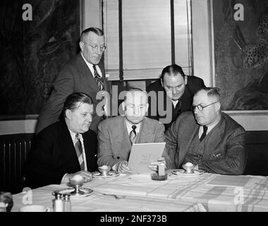 Bert Bell, commissioner of the NFL, holds football near photo mural of  Yankee Stadium in the New York Yankees' downtown office, Jan. 27, 1956. The New  York Giants of the NFL announced