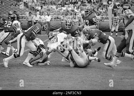 Washington Redskins running back John Riggins (44) hits a stone wall of  Atlanta Falcons as he attempts a run in the game between the Redskins and  the Atlanta Falcons in Washington, Aug.