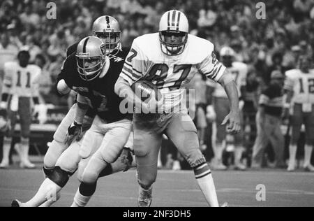 Houston Oilers Alvin Reed in action, tackle by Oakland Raiders