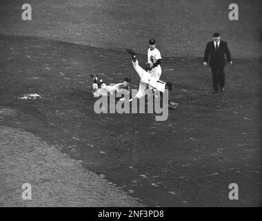 Shortstop Luis Aparicio of the Chicago White Sox reaches high to