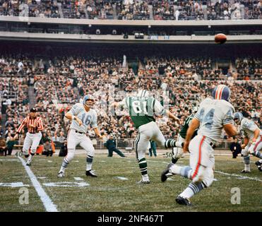 Joe Namath of the New York Jets, #12 in green shirt, during game against  the Houston Oilers, Nov. 1965. (AP Photo Stock Photo - Alamy