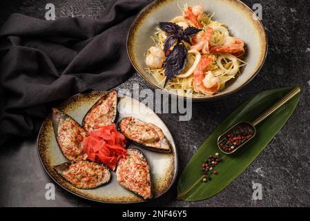 mussels with cheese and pasta with seafood. High quality photo Stock Photo