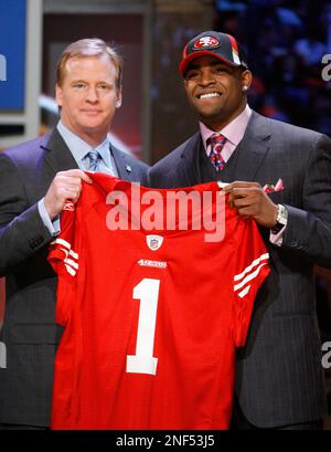 Texas Tech wide receiver Michael Crabtree holds up a jersey after he was selected as the 10th overall pick by the San Francisco 49ers during the first round of the NFL Draft at Radio City Music Hall S...