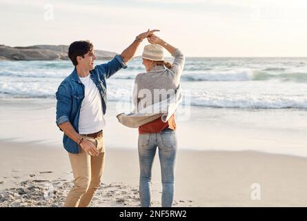 Take that beach vacation, you wont regret it. a middle aged couple spending the day at the beach. Stock Photo