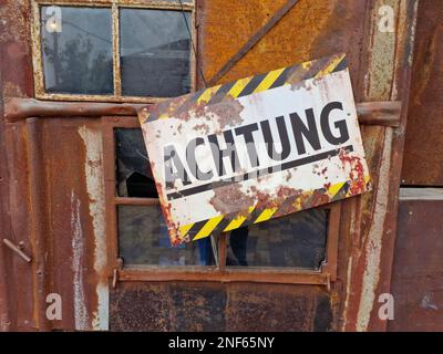 Rusty Dirty Old Safety Danger Sign On Metal Stock Photo