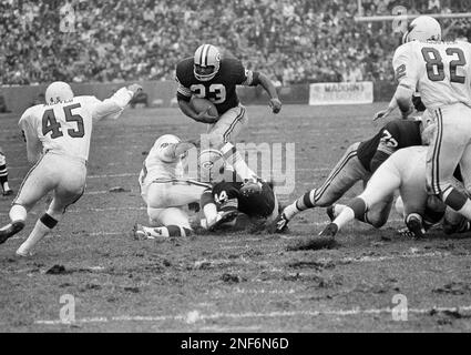 Green Bay Packers Travis Williams (23) runs over his blocker, Donny Anderson  (44), during game against Philadelphia Eagles at Milwaukee, Oct. 26, 1970.  Williams kept his balance and made about six yards. Anderson was blocking  Eagles' Adrian Young