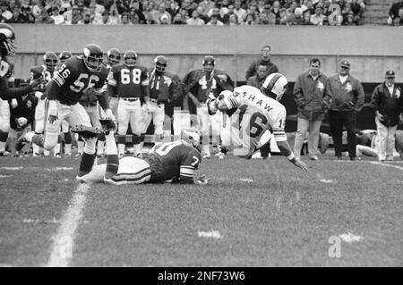 FILE ** Minnesota Vikings' Jim Marshall (70) clutches the game ball as he  is carried off the field by teammates Doug Southerland, left, and Scott  Studwell after the Vikings beat the